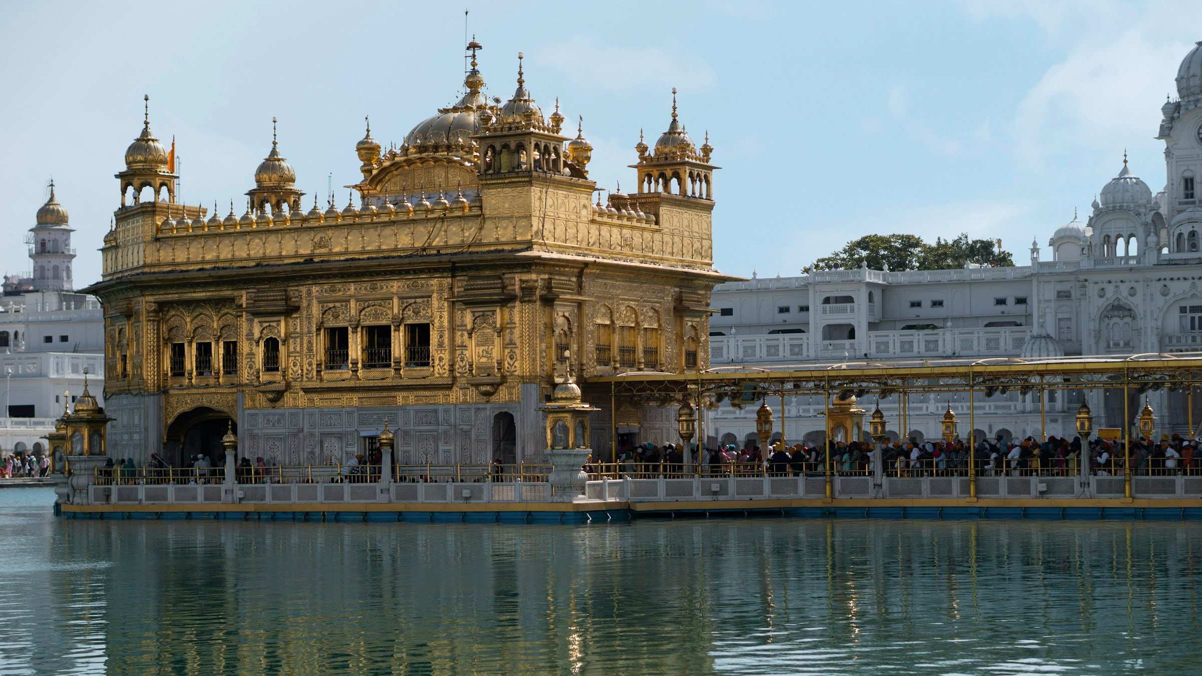 Sri Harmandir Sahib across the sarovar, the causeway and the marble parikrama